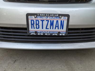 License plate reading "RBTZMAN" 