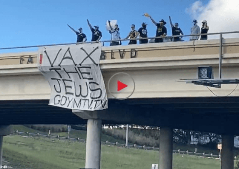 Neo-Nazis holding Vax the Jews banner in Austin