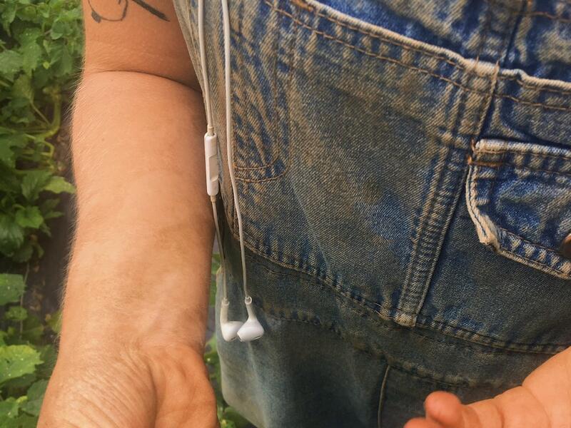 Photo of someone's hands holding ground cherries