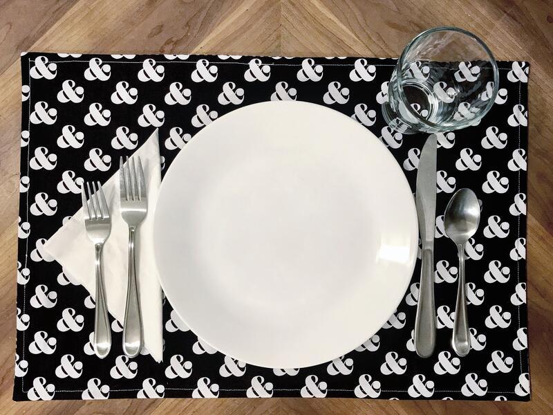 Place setting with "&"-Themed Placemat