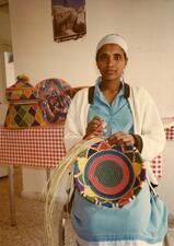 Ethiopian Jewish woman with woven basket. Israel, 1982. 