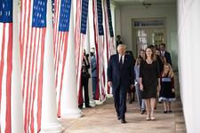 Donald Trump walks with Amy Coney Barrett