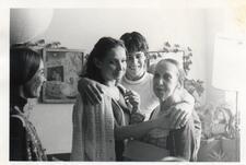 Cecilia Baram meeting Anna Sokolow, with another woman standing in the corner and a young man putting his arms around both dancers
