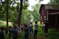 An organizer gives a farm tour