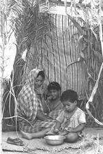 A family in a sukkah, 1954.