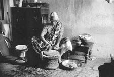 Woman Baking Bread in Bombay