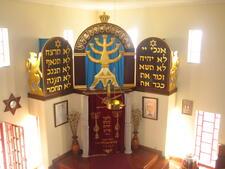 Interior of synagogue in Belmonte, showing bimah and the traditional rezadeiras oil lamp