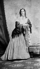 Portrait of Emma Mordecai in a nineteenth century dress with a shawl and curled hair 