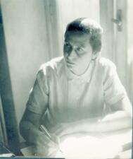 Fanny Eldman writing at a desk