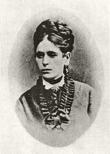 A portrait of Miriam Markel Mosessohn, wearing a dress with a frilled collar