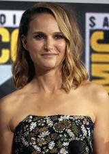 Half-portrait of Natalie Portman in embroidered floral strapless dress at Comic Con