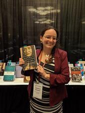 Jessica Kirzane with her book