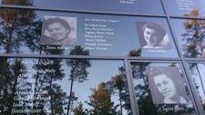 Close up on three glass panels. There are three black and white photos of women on the windows, and two lists of names.