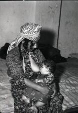 Iraqi Jewish woman breastfeeding, 1951. 