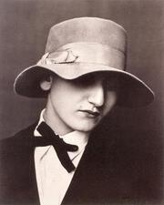 A portrait of Anita Brenner, wearing a hat with a wide brim bent to obscure her eyes
