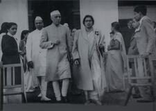 Hannah Sen walking out of a building with Nehru