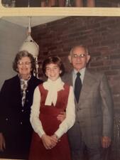 Carole Balin posing for a photo with her grandparents.
