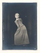 black and white photograph of an actor in a long dress