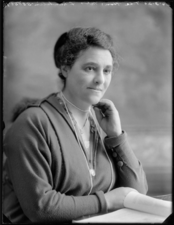 Henrietta Franklin sitting at a desk with a notebook in front of her