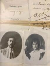 Black-and-white passport photos of a man and a woman