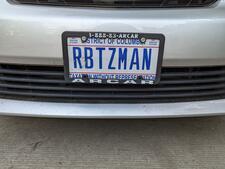 License plate reading "RBTZMAN" 