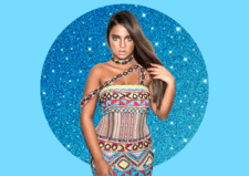 Israeli singer Noa Kireal against sparkly blue background
