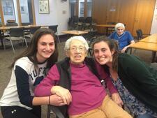 Elderly woman with two teenage girls