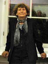 Ewa Kurlyuk standing in front of a window