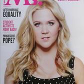 Amy Schumer wearing a polka dot sleeveless top on the cover of Ms. Magazine, the title in dark pink