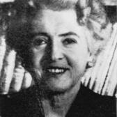 Cropped photo of Bertha Solomon in front of a bookshelf