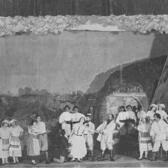 Yiddish theater performers on stage in a play. 