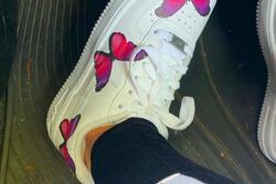 Sneaker with butterflies on it