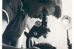 Rosalind Franklin with Microscope in 1955