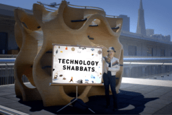 Tiffany Shlain with "Technology Shabbats" sign