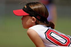 Stock Image of Girl Wearing Athletic Jersey and Visor