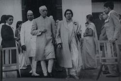 Hannah Sen walking out of a building with Nehru