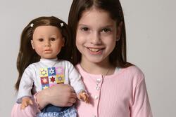 A Girl Holding a Gali Girls Doll