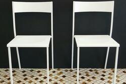 White chairs against a black wall