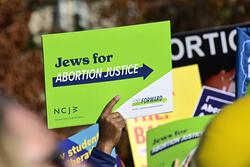 Green sign reading "Jews for Abortion Justice" 