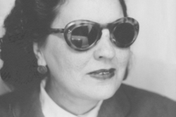 Black and white photo of singer Sultana Daoud wearing sunglasses