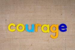 "Courage" Spelled in Felt Letters
