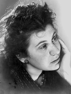 Portrait of Etty Hillesum, looking off-camera with her chin in her hand