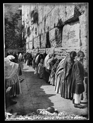 Men and women lined up in prayer along the Western Wall