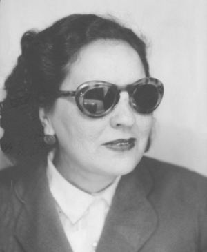 Black and white photo of singer Sultana Daoud wearing sunglasses