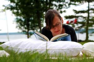 Woman Reads Outside