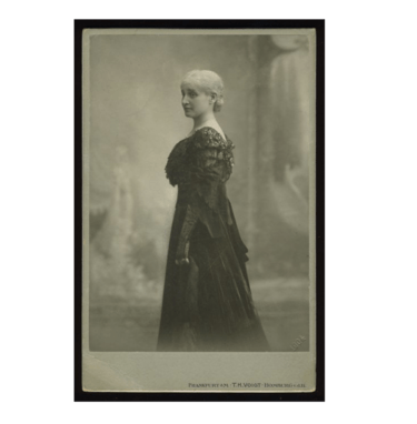 Studio portrait of Bertha Pappenheim wearing a dark, formal gown and long gloves