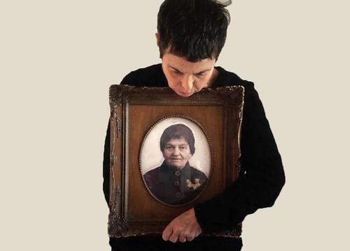 Rachel Finkelstein's "Hug" holding a photo of her grandmother