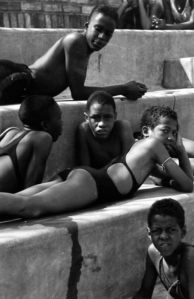 Cropped version of "Swimming Pool and Children" by Sid Grossman, 1939. Children now appear closer to camera and blurred figure has been cropped out. 