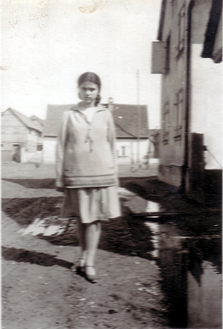 Andree Salomon standing in a street, wearing a drop-waist 20s dress