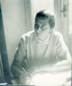 Fanny Eldman writing at a desk